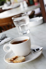 A cup of espresso coffee in a cafe setting