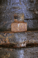 Fragment of joining of details a bolt with corrosion and a dirt