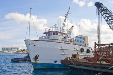 Fototapeta premium Old Boat by Dock Construction