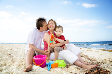 Happy family having fun on the beach.