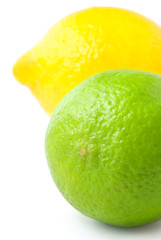 Close up of fresh green lime and lemon isolated on white