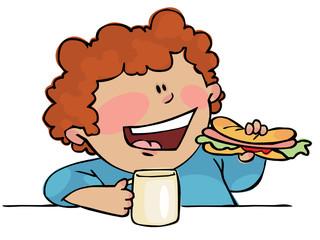 Young boy eating hotdog