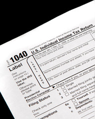 Tax forms on a black background - vertical