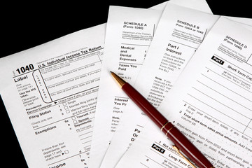 Obraz premium Tax forms on a black background