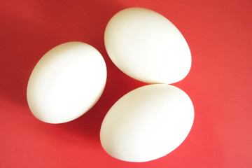 three eggs on red