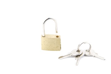 Golden open padlock with keys on white