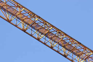 Fototapeta na wymiar Fragment of a steel design of the hoisting crane