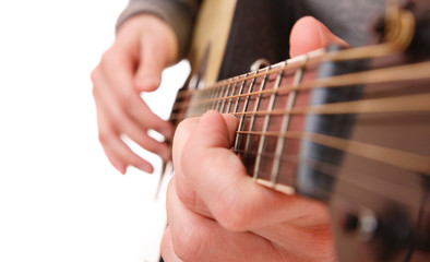 Fototapeta na wymiar Close up of guitarist hand playing guitar