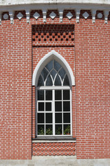 One arched window on red brick building