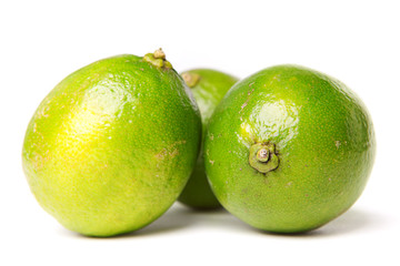 green limes isolated on white