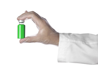 Fototapeta premium Green vial on a hand