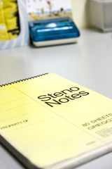 it is a steno book on office table.