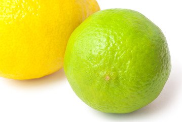 Close up of fresh green lime and lemon isolated on white