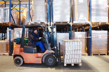 warehouse work with forklift loader