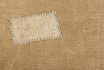 Sackcloth tag on sackcloth material