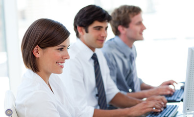 Obraz premium Animated business people working at computers