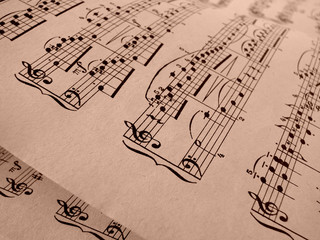 sepia toned old sheets of musical notes