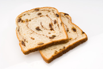 two slices of cinnamon raisin bread isolated with clipping path - 20398533
