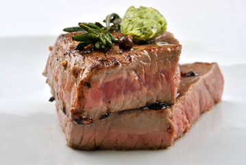 grilled organic steak on a white plate