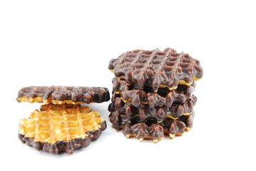Chocolate waffles stacked on white