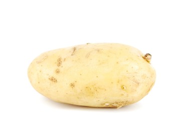 Unpeeled yellow potato on white