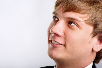 Fototapeta premium Portrait of young man on gray background