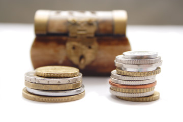 Coins against the wooden chest