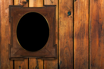 vintage photo-frame on wooden wall