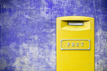 yellow mail-box over grunge background