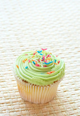 Vanilla cupcake with green lime icing