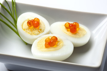 Boiled quail eggs with chives as an appetizer