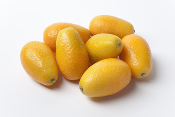 Kumquats on white background