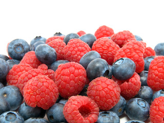 Blueberry and raspberries on white background