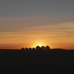 Row of Houses Silhouetted at Sunset