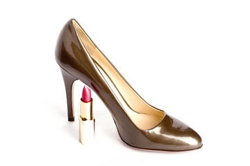 Beige-golden female new varnished shoes on high heel-stiletto