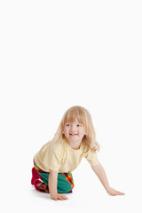 boy on the floor smiling