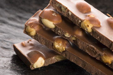 Pile of broken chocolate with nuts