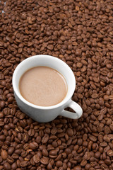 Cup with coffee, costing on coffee grain