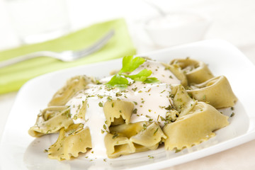 dish of tortellini with cheese sauce