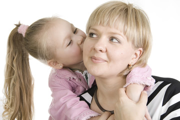 Daughter kissing her mother.