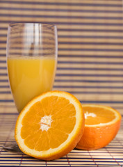 fresh orange juice on colored mat