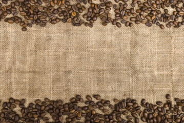 Coffee beans and sackcloth background