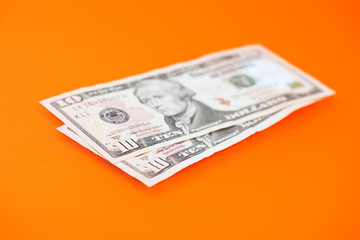 dollars on color background