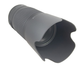 forward view of camera lense with hood on white