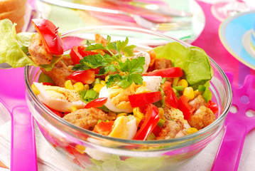 fresh salad with breaded meat and vegetables