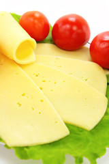 Cheese, tomatoes and lettuce on the plate