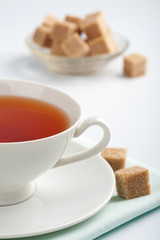 cup of tea and cane sugar