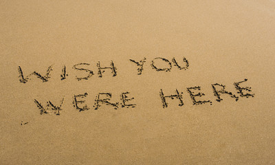 Wish You Were Here written in sand