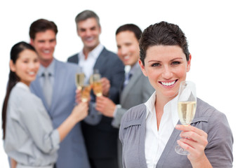 Positive business team toasting with Champagne