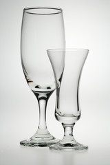 Empty drinks glasses on white background